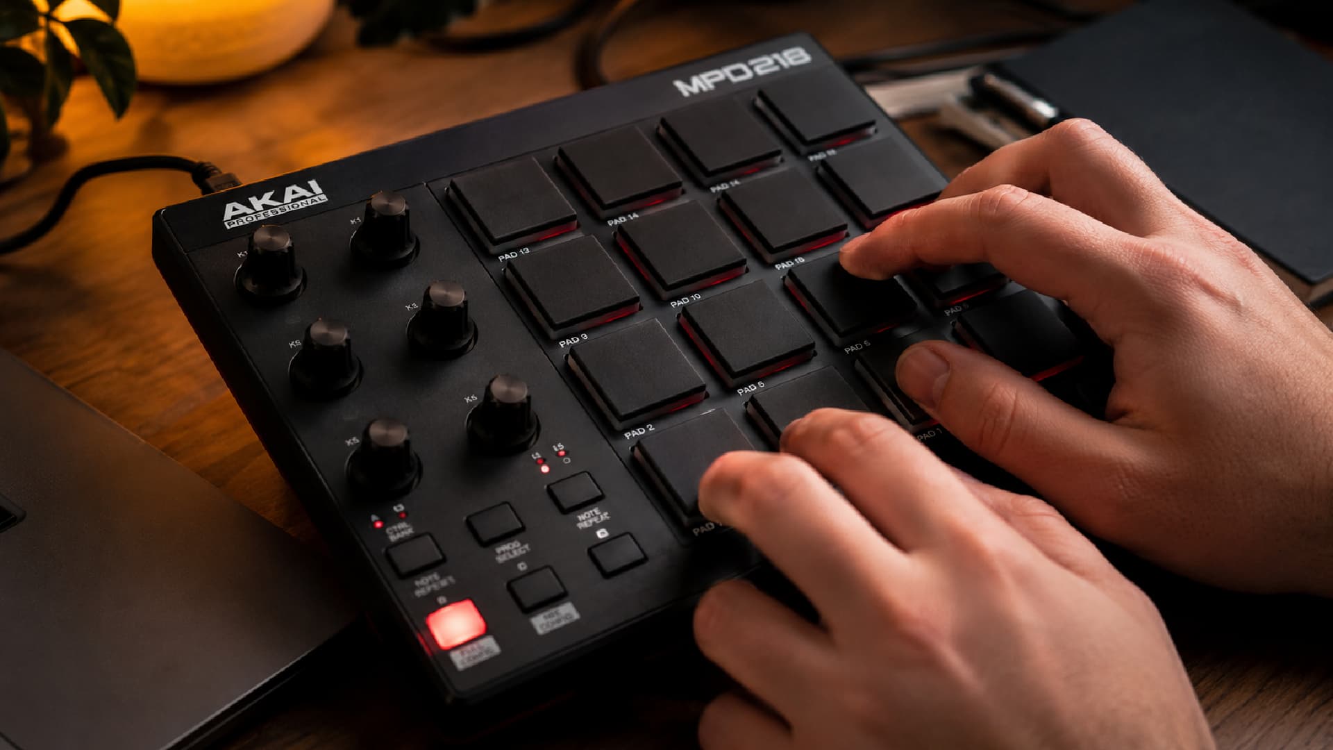 Close-up of an Akai MPD218 in use